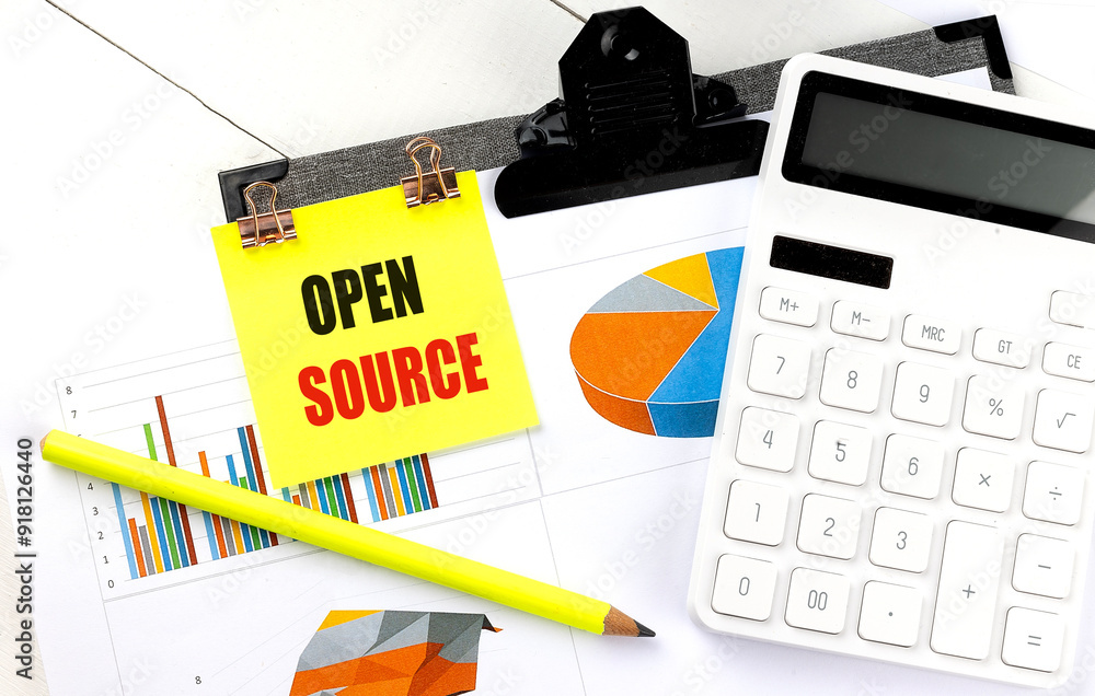 Poster open source text on yellow sticky with calculator, pencil and chart