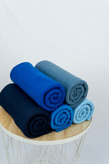 roll of polyester fabric in blue color variant with white background with high level 