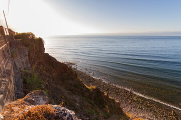 Seascape. Views of Atlantic Ocean from a cliff. Rocky beach. Sunset on the beach. Tenerife, Bajamar, Canary Islands.