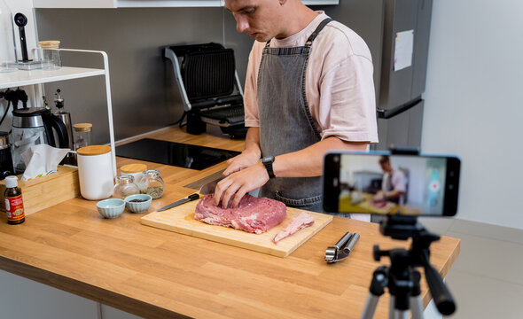The chef is broadcasting live from workshop how to prepare a beef steaks on the electric grill