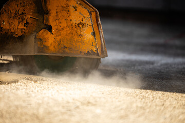 Close up view of circular construction machine cutting asphalt or concrete. Road maintenance and construction.