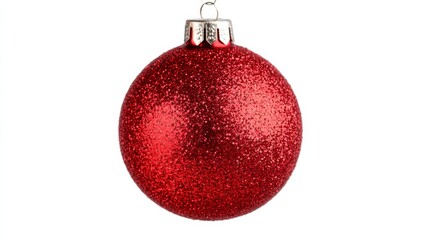 Closeup of a vintage Christmas ornament, a shiny red bauble with glittering details, hanging on a...