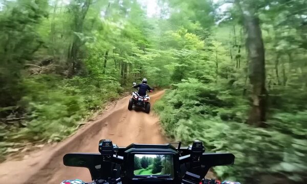 Two Man on ATV in forest video Selfe