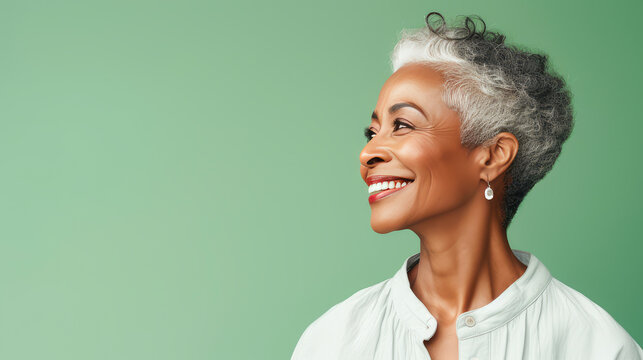 Elegant, elderly pensioner, chic African American woman with gray short hair, creamy beige background, banner.