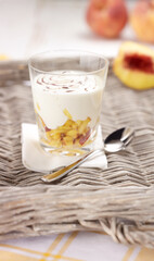 Fresh Peach Yogurt Parfait with Chocolate Swirl in a Glass