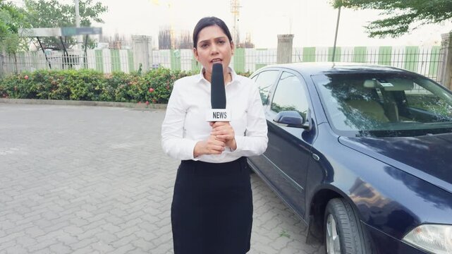 Female Reporter with Microphone Outdoors