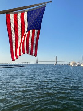 USA Flag The Ravenel Bridge Charleston, SC from the water on a boat