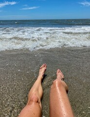 Beach Day Woman's legs feet Atlantic Ocean Waves
