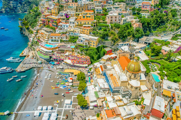 Positano town, beach and beautiful colorful houses on the cliff in Amalfi coast in Italy