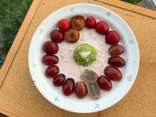 Strawberry overnite oat meal with Red bean green tea Greek yogurt with cherry and grapes