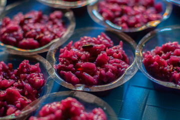 Black fermented glutinous rice in a plastic cup.