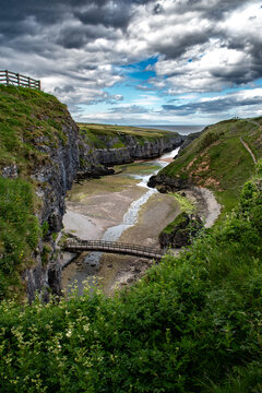 Narrow Canyon And Entrance To Smoo Cave, Hideout Of Bonnie Prince Charles, At The Atlantic Coast Near Durness In Scotland, UK