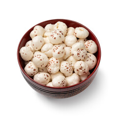Bowl with puffed Lotus seed isolated on white background close up