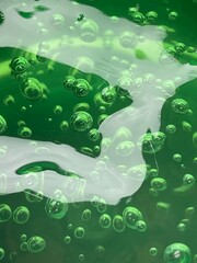 green bubbles in water background 