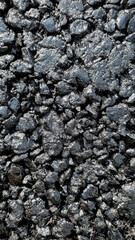 New laid asphalt road, large crushed stone.  Close-up. Background.