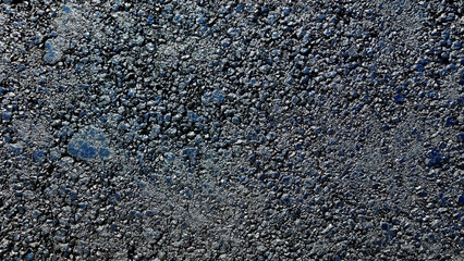 New laid asphalt road, large crushed stone.  Close-up. Background.