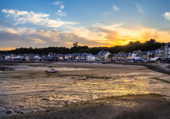 Serene coastal village of Cancale in french Brittany at sunset.