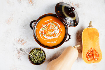 Traditional autumn butternut squash soup with seeds.