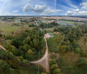 Fototapeta premium View of the roads, landscape and fields from the height of a flying drone. 