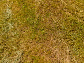 Landscape view from drone, yellow fields and haystacks. 