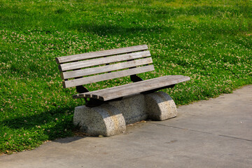 Wooden benches and chaise lounges for rest on the streets of the city and in the park, public places