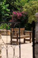 Wooden benches and chaise lounges for rest on the streets of the city and in the park, public places