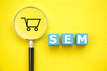 SEM-Search Engine Marketing concept; Magnifier glass with text 