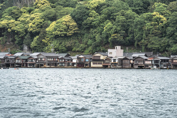 Beautiful scenic view with the wooden traditional waterfront boat houses called funaya around Ine Bay, in the village Ine, Japan