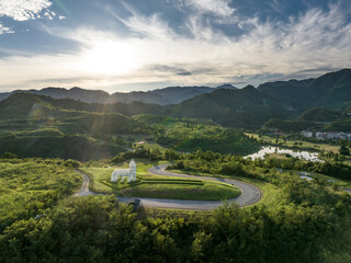 view of curve road near mountain