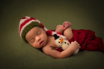 African newborn baby with christmas snowman