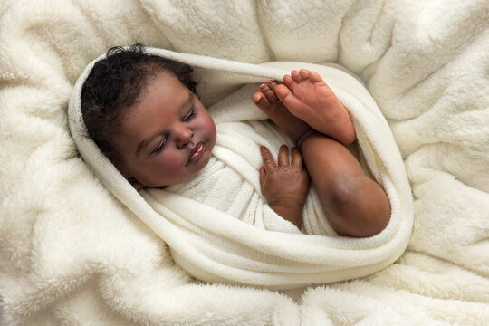 African reborn doll wrapped in white