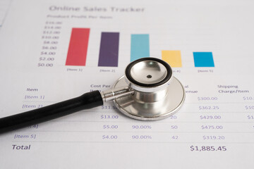 Stethoscope on spreadsheet and graph paper, Finance, Account, Statistics, Investment, Analytic research data economy and Business company concept.