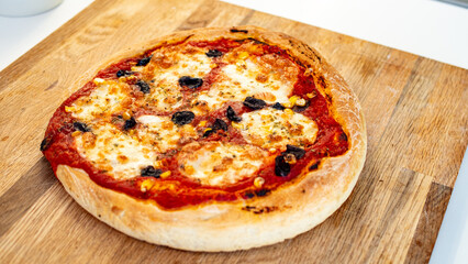 Fresh, hot, oven-baked Italian Neapolitan pizza with mozzarella cheese