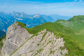 The Stoos hike in summer offers breathtaking views of the Swiss Alps, lush green meadows, and serene lakes. The trail is accessible yet challenging, with panoramic vistas that make every step rewardin