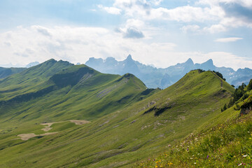 Fototapeta premium The Stoos hike in summer offers breathtaking views of the Swiss Alps, lush green meadows, and serene lakes. The trail is accessible yet challenging, with panoramic vistas that make every step rewardin