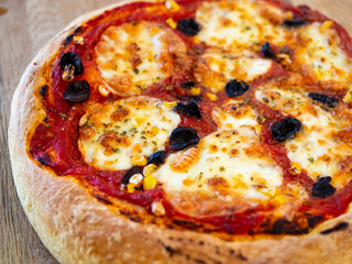 Fresh, hot, oven-baked Italian Neapolitan pizza with mozzarella cheese