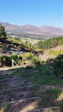 Western Cape South Africa, 30.05.2024. Video, Footpath in Wedderwill near Somerset West looking towards Hottentots mountains.