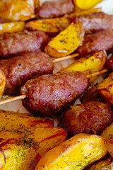 Fried potatoes with chicken Kiev. Pork, beef shashlik.