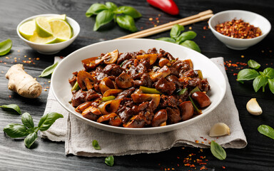 Beef Mushroom Stir Fry with ginger and garlic in a white plate