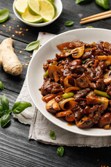 Beef Mushroom Stir Fry with ginger and garlic in a white plate