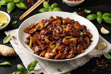 Beef Mushroom Stir Fry with ginger and garlic in a white plate