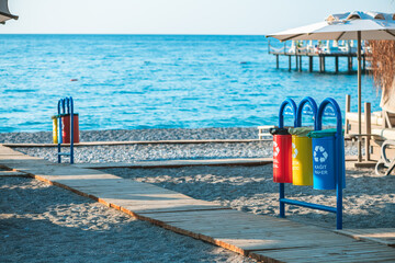 containers, trash bins for separate waste on the beach, waste recycling, environmental protection