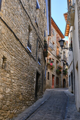 houses and cobbled streets in a typical village in the Aragonese Pyrenees, Boltaña , Huesca, Spain.