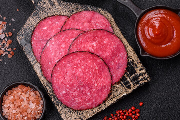 Delicious smoked salami sausage sliced with salt, spices and herbs