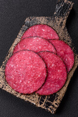 Delicious smoked salami sausage sliced with salt, spices and herbs