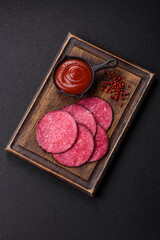 Delicious smoked salami sausage sliced with salt, spices and herbs