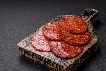 Delicious smoked pepperoni sausage sliced with salt, spices and herbs