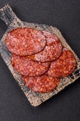 Delicious smoked pepperoni sausage sliced with salt, spices and herbs