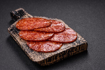 Delicious smoked pepperoni sausage sliced with salt, spices and herbs