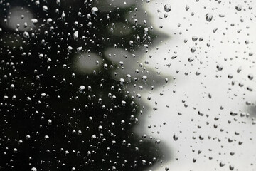 scratched glass surface monochrome gradient background dirty grunge image wallpaper mock up template pattern and water drops narrow focus concept